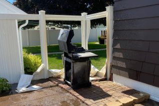 Warped Fence & Siding Caused by a Grill