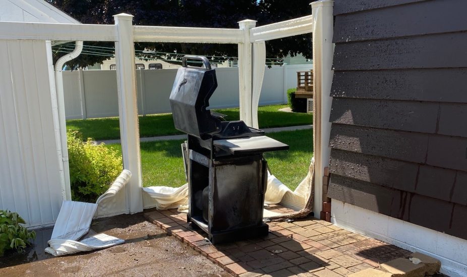 Warped Fence & Siding Caused by a Grill