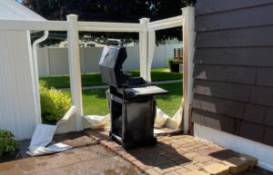 Warped Fence & Siding Caused by a Grill